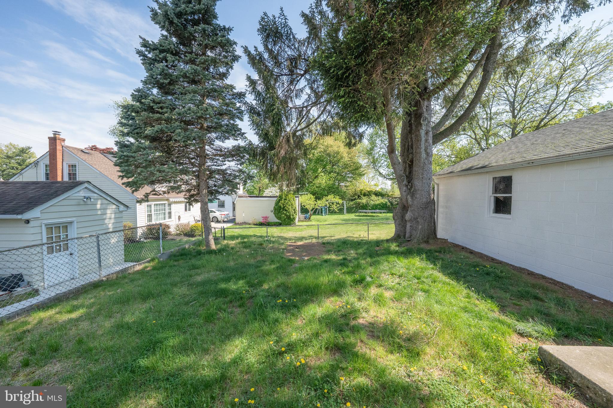 1305 Center Road Drexel Hill, PA 19026 - Photo 32 of 37 a view of a yard with plants and trees