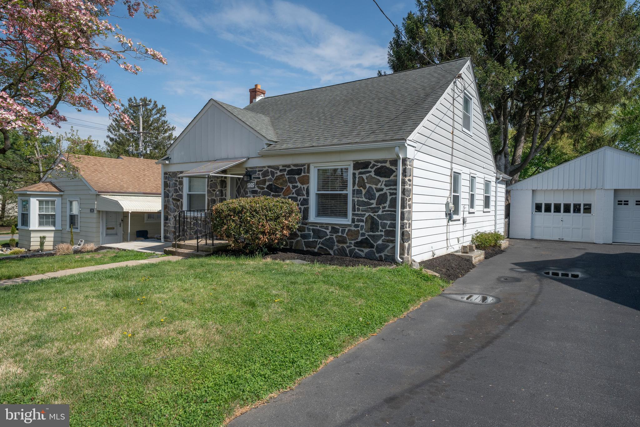 1305 Center Road Drexel Hill, PA 19026 - Photo 35 of 37 a view of a house with a garden