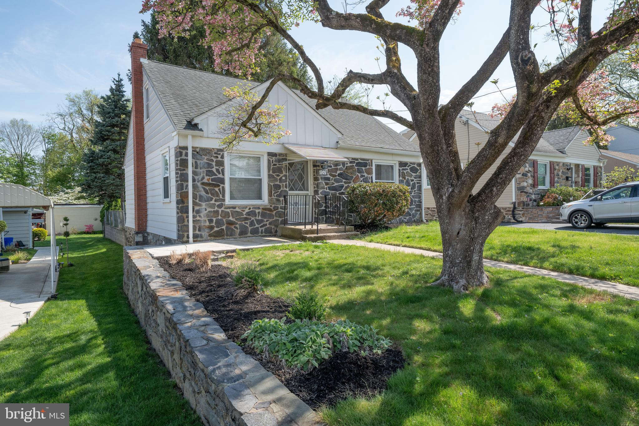 1305 Center Road Drexel Hill, PA 19026 - Photo 36 of 37 a view of a house with yard and a garden