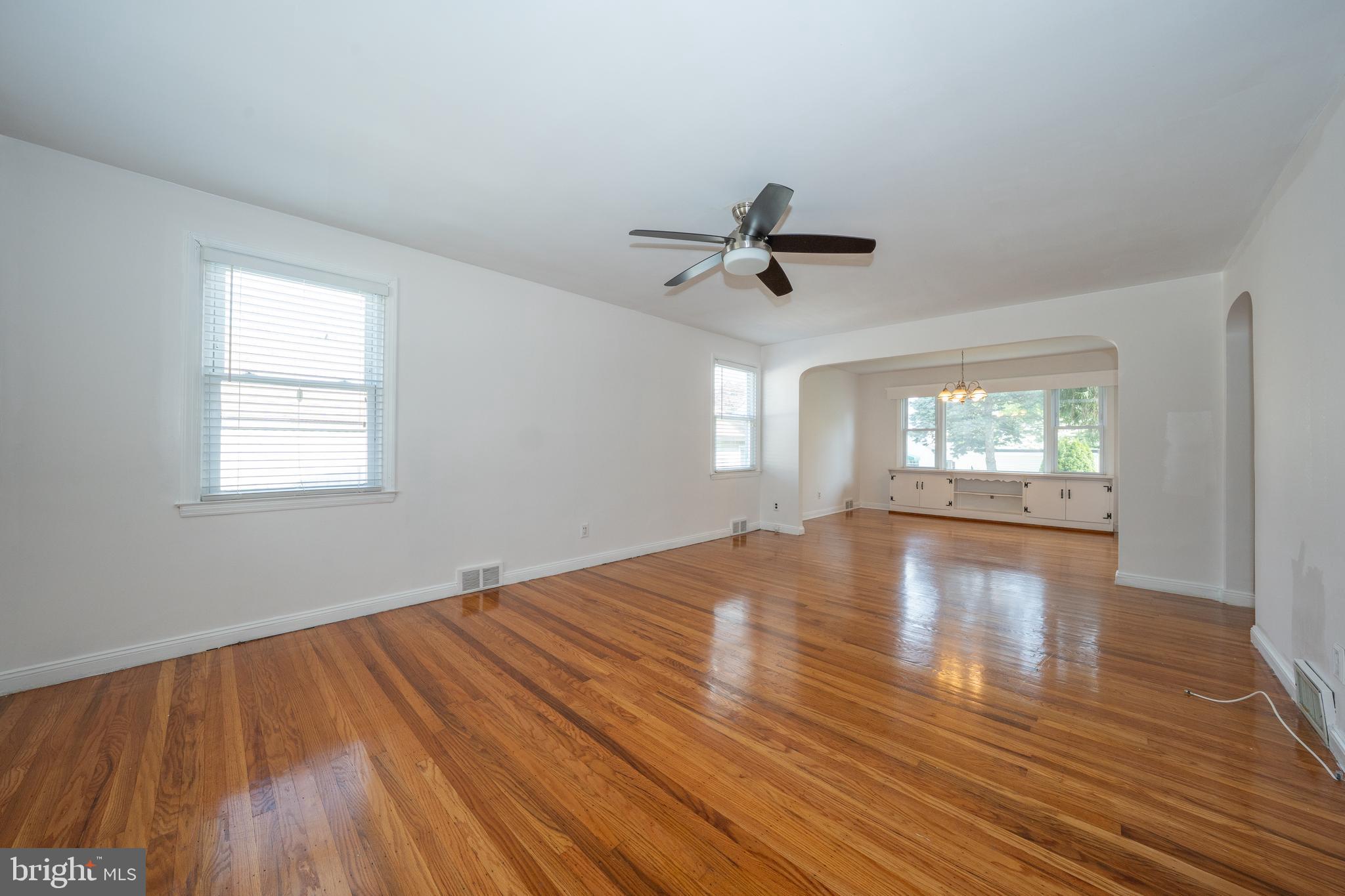 1305 Center Road Drexel Hill, PA 19026 - Photo 4 of 37 a view of empty room with wooden floor and fan