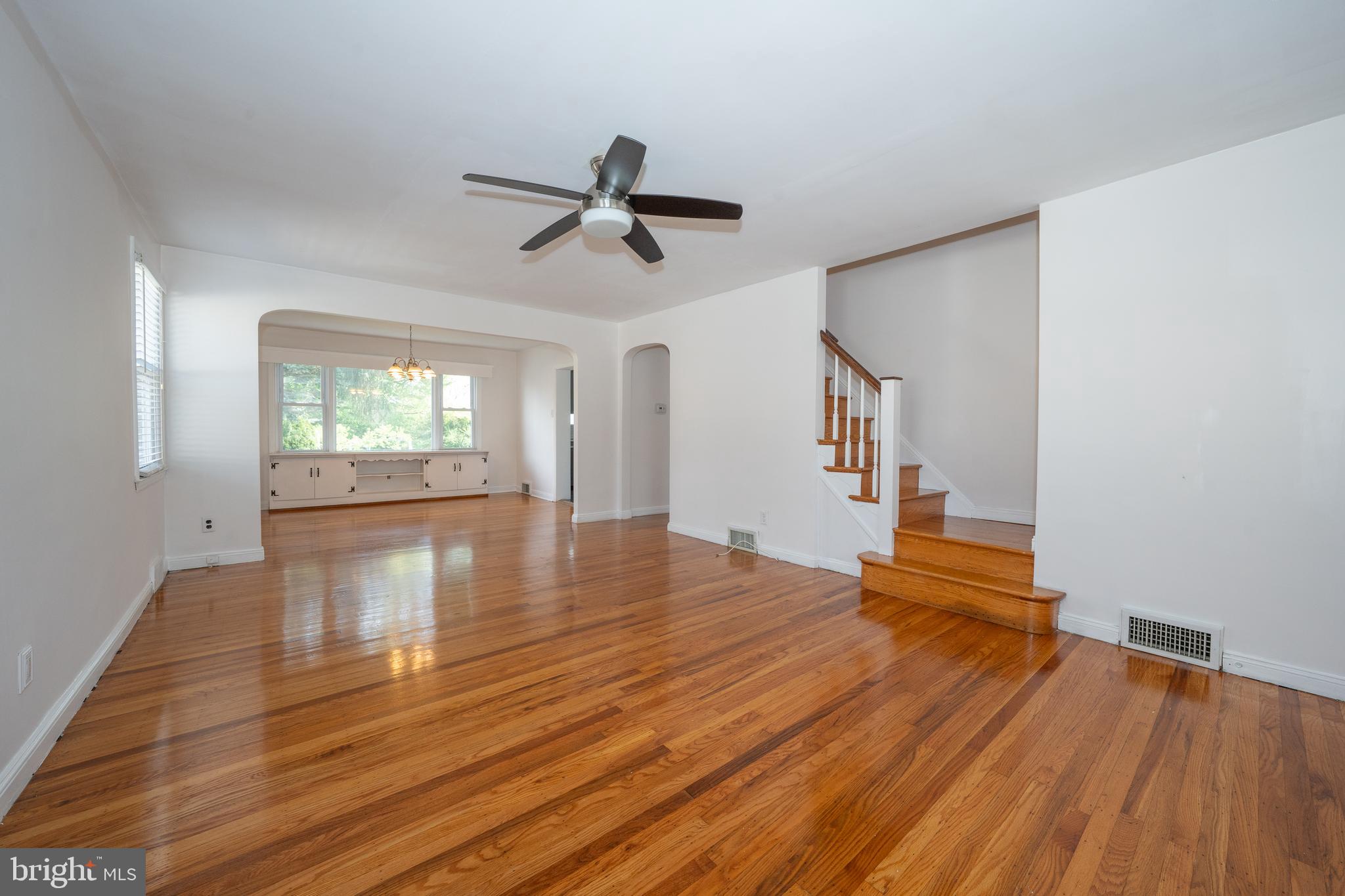 1305 Center Road Drexel Hill, PA 19026 - Photo 5 of 37 a view of empty room with wooden floor and fan