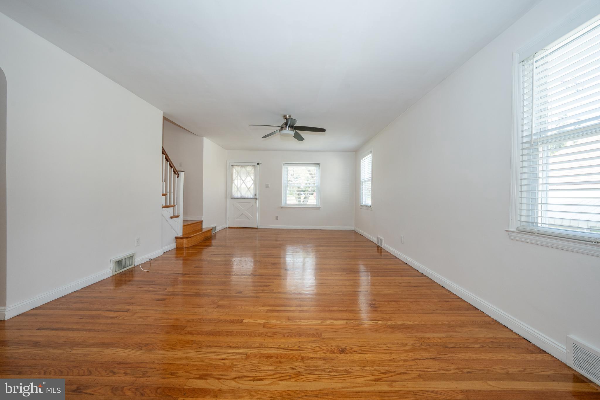 1305 Center Road Drexel Hill, PA 19026 - Photo 6 of 37 a view of empty room with wooden floor and fan