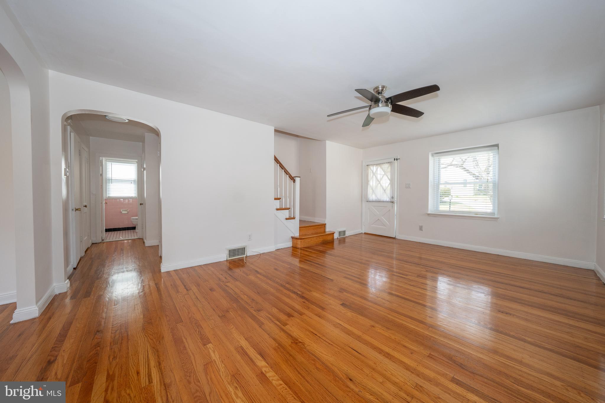 1305 Center Road Drexel Hill, PA 19026 - Photo 7 of 37 wooden floor in an empty room with a window