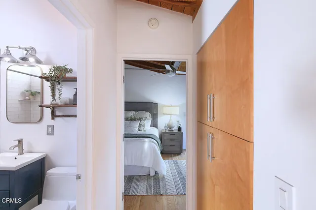 a en suite bathroom with a sink toilet and mirror