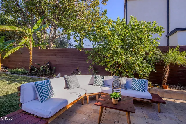 a outdoor living space with furniture and a potted plant