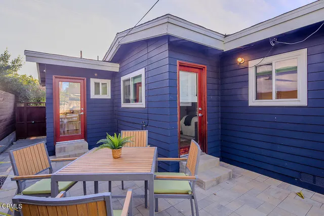 a view of a chairs and table in a patio