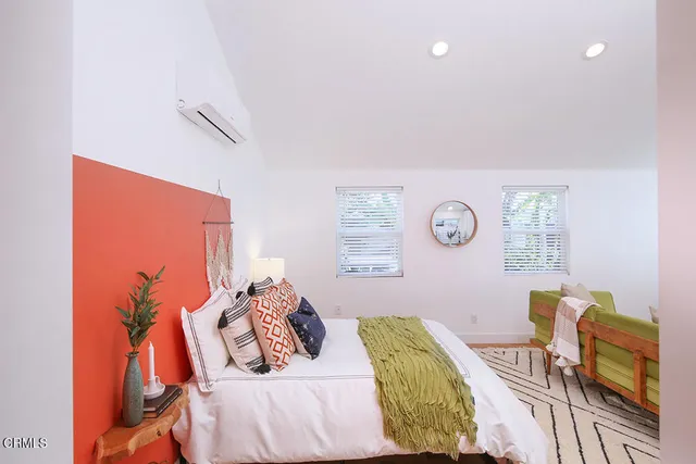 a bedroom with a bed and ceiling fan