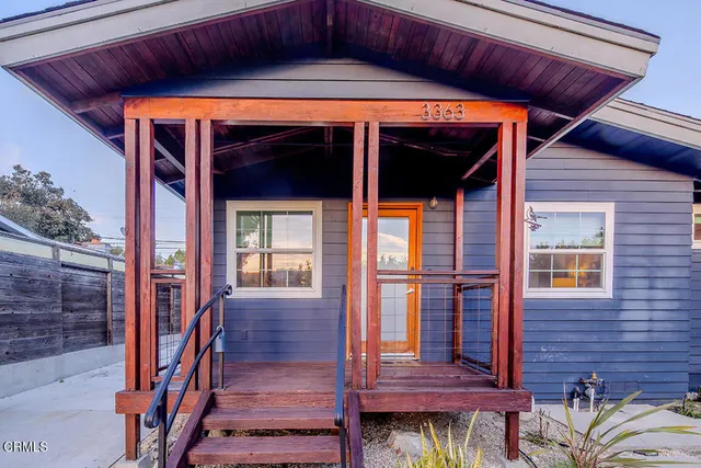 a front view of a house with glass windows