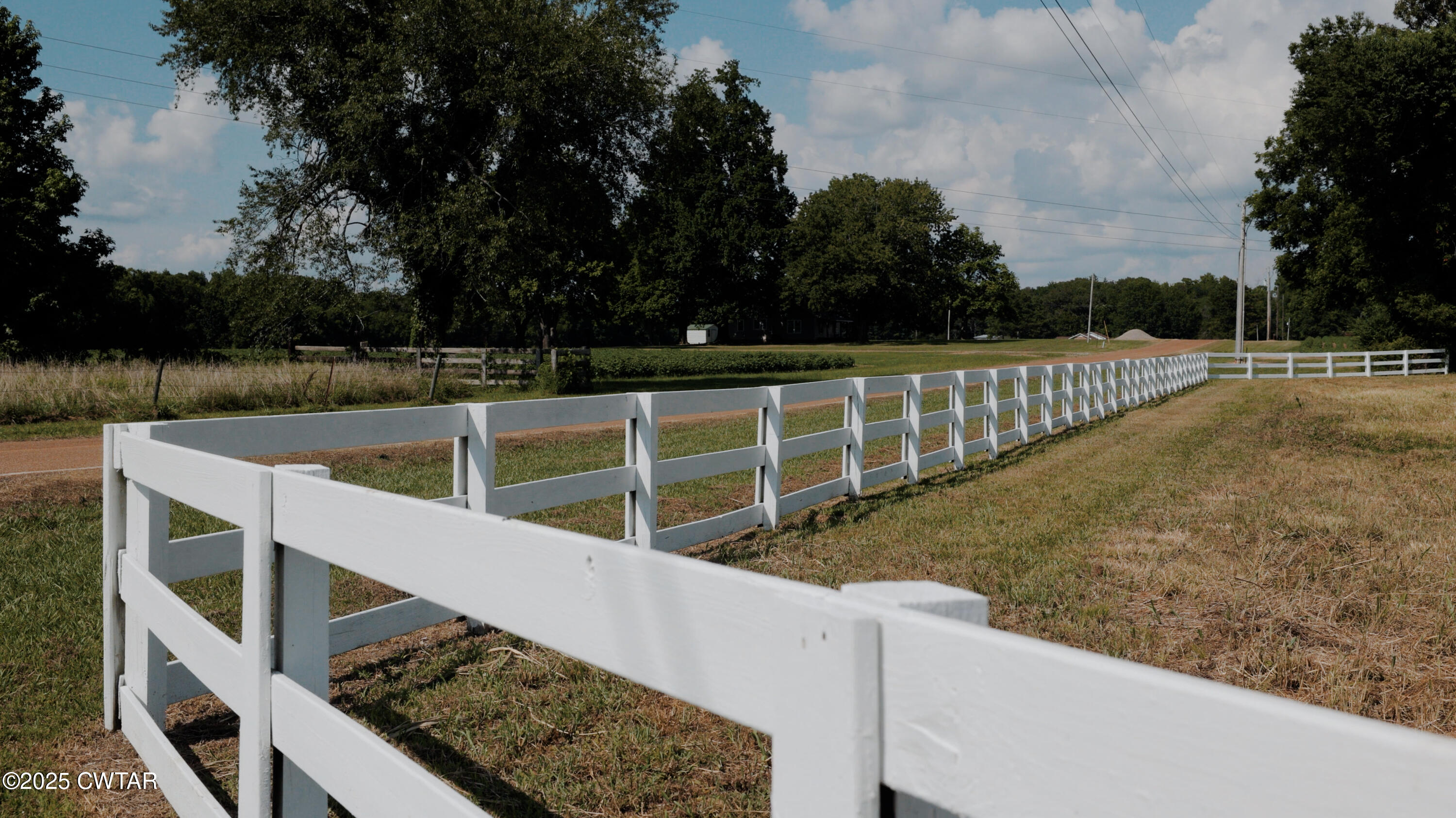 a view of balcony with wooden floor and fence