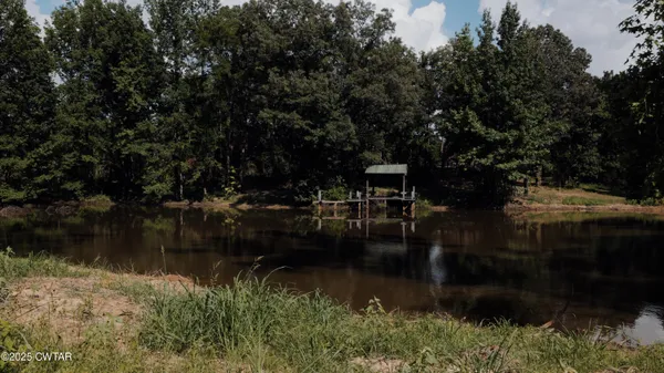 a view of a lake with a yard
