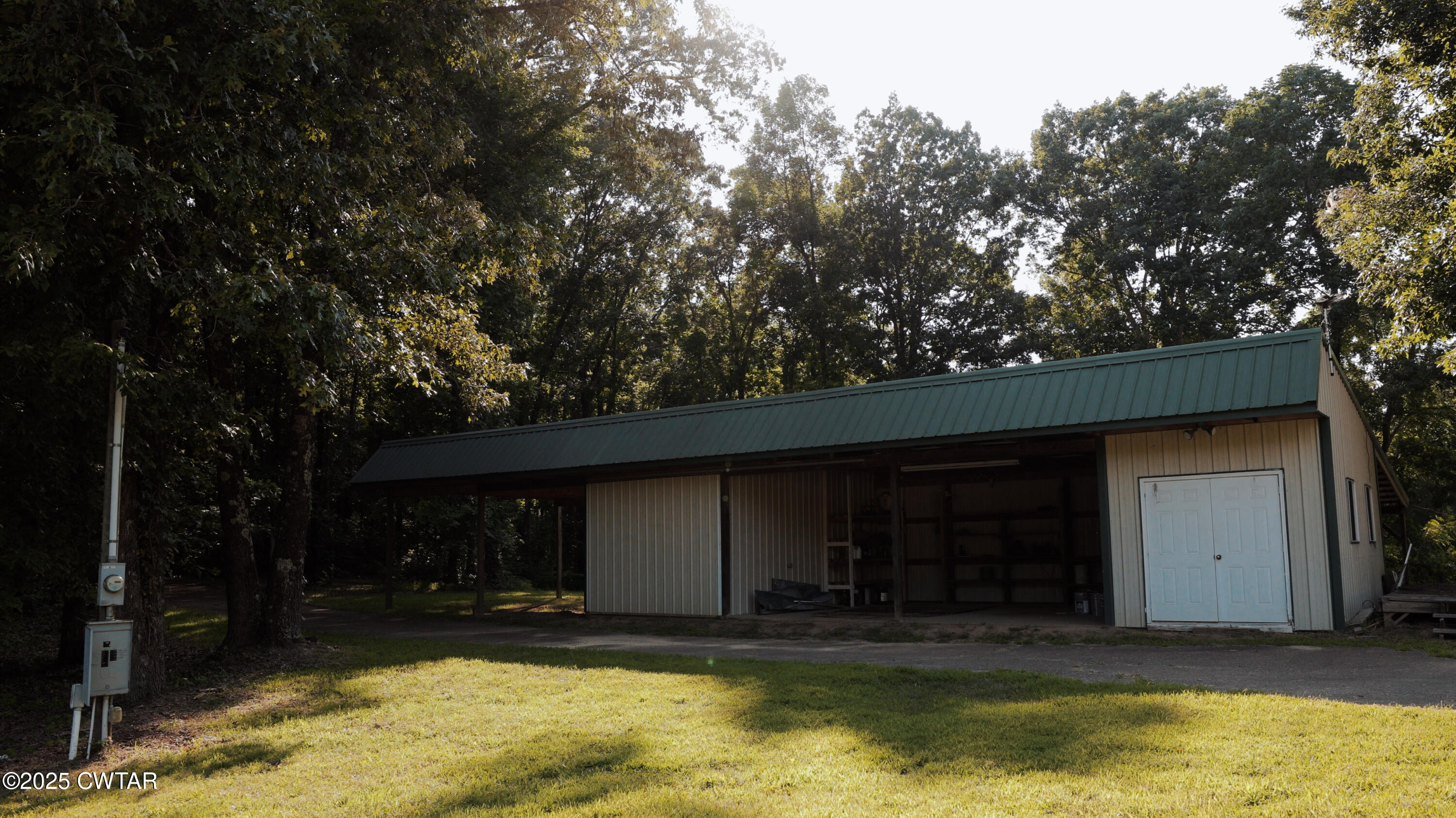 0 Ames Road Hickory Valley, TN 38042 - Photo 8 of 20 a view of a house with a yard balcony and a tree with a barbeque