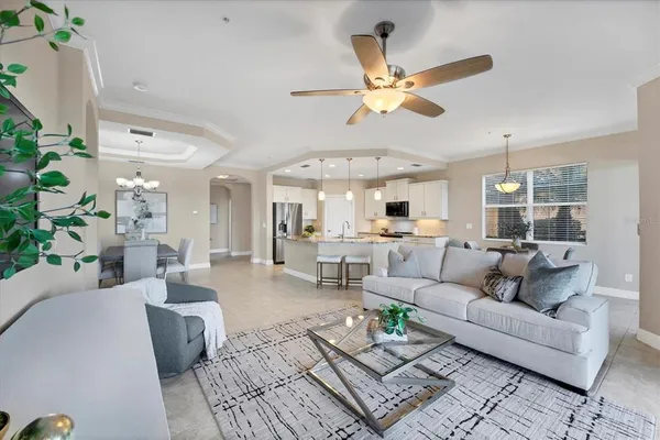 a kitchen with stainless steel appliances granite countertop a stove oven and a refrigerator with white cabinets