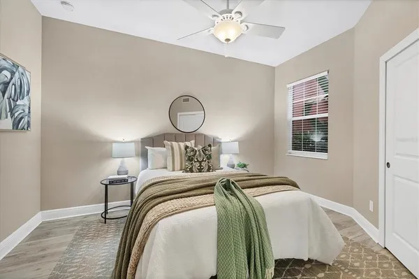 a living room with furniture and a floor to ceiling window