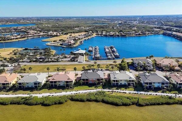 a view of a patio with table and chairs potted plants with wooden floor