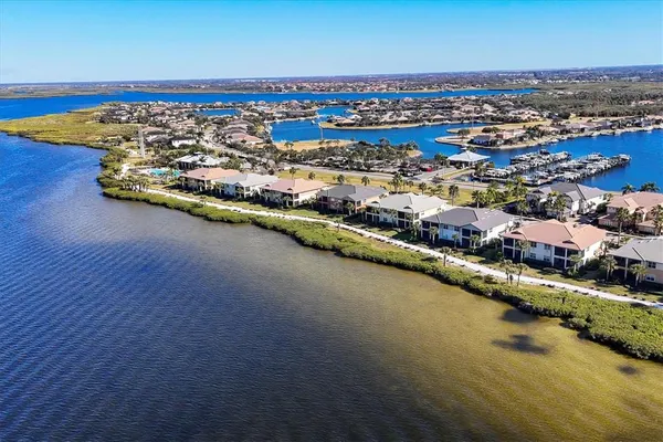 a room with pool table windows and ceiling fan