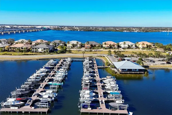 a kitchen with stainless steel appliances granite countertop a refrigerator a stove top oven a sink and dishwasher