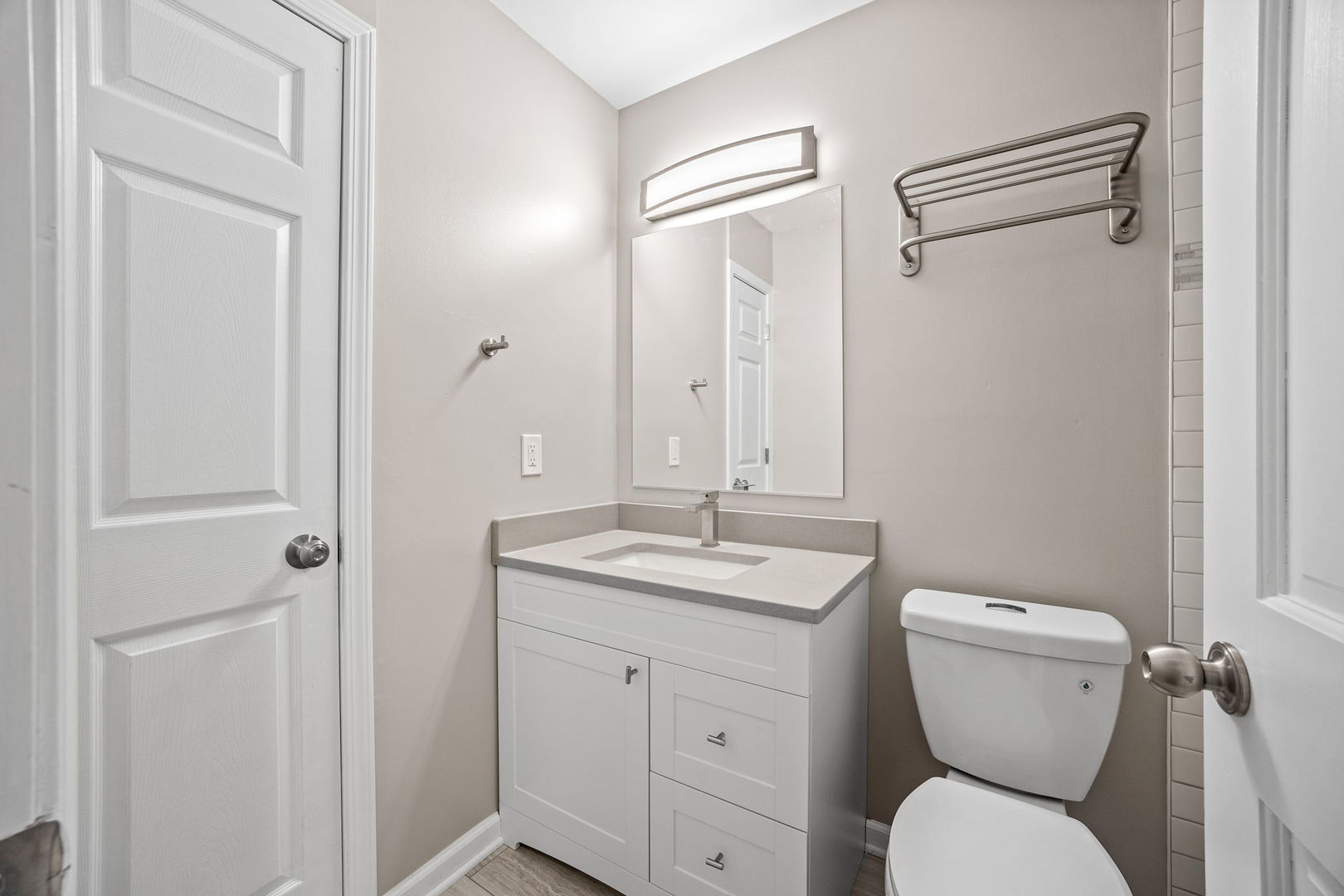 130 Saugatuck Road Montgomery, IL 60538 - Photo 9 of 31 a bathroom with a granite countertop toilet sink and mirror