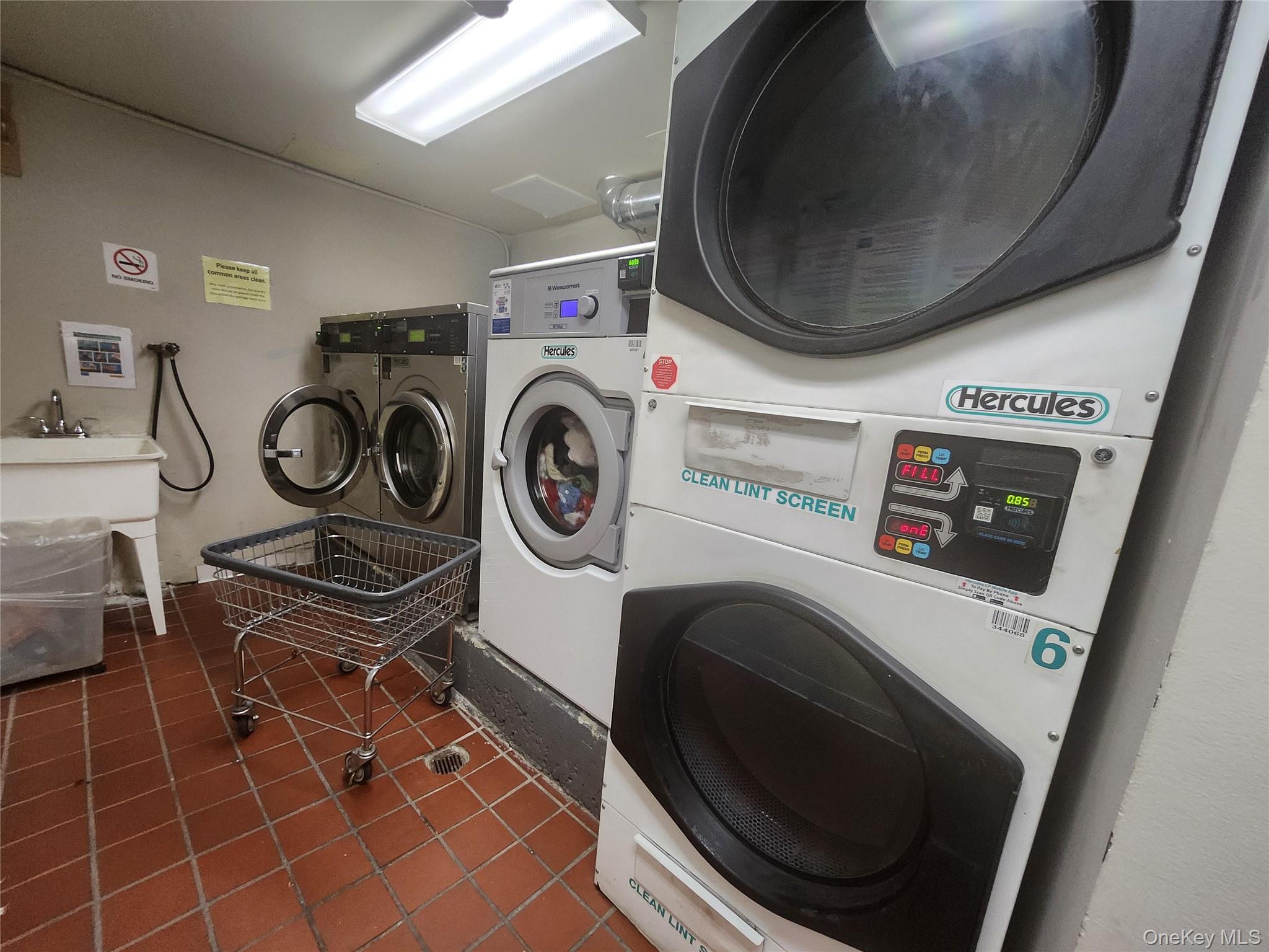 87-14 57th Road, Unit PHA Queens, NY 11373 - Photo 15 of 15 a utility room with dryer and washer