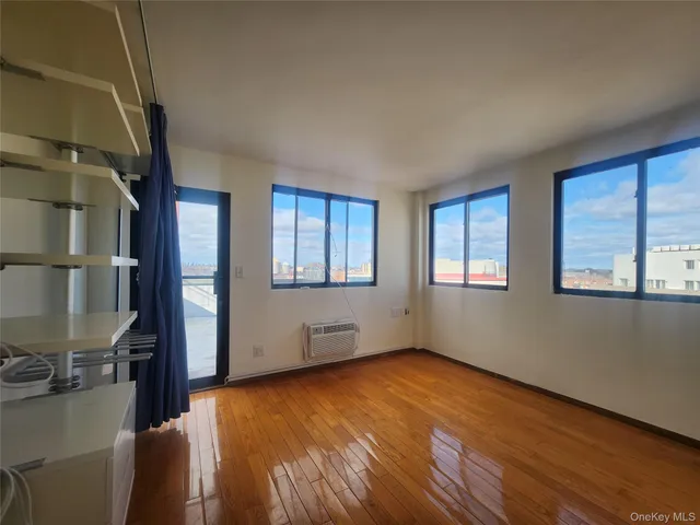 a view of livingroom with hardwood floor and window