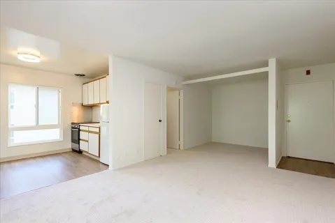 a view of a kitchen with a sink and a stove top oven