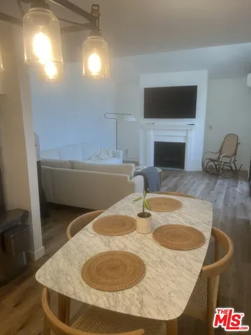 a bathroom with a granite countertop sink a toilet and a tub