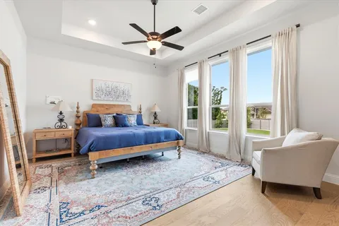a bedroom with a bed and a couch