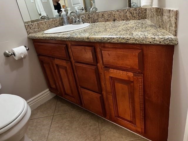 2290 North Fulton Beach Road, Unit B317 Rockport, TX 78382 - Photo 23 of 40 a bathroom with a granite countertop sink and toilet