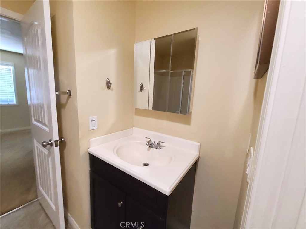 794 Brownie Way Beaumont, CA 92223 - Photo 5 of 18 a bathroom with a sink and a mirror