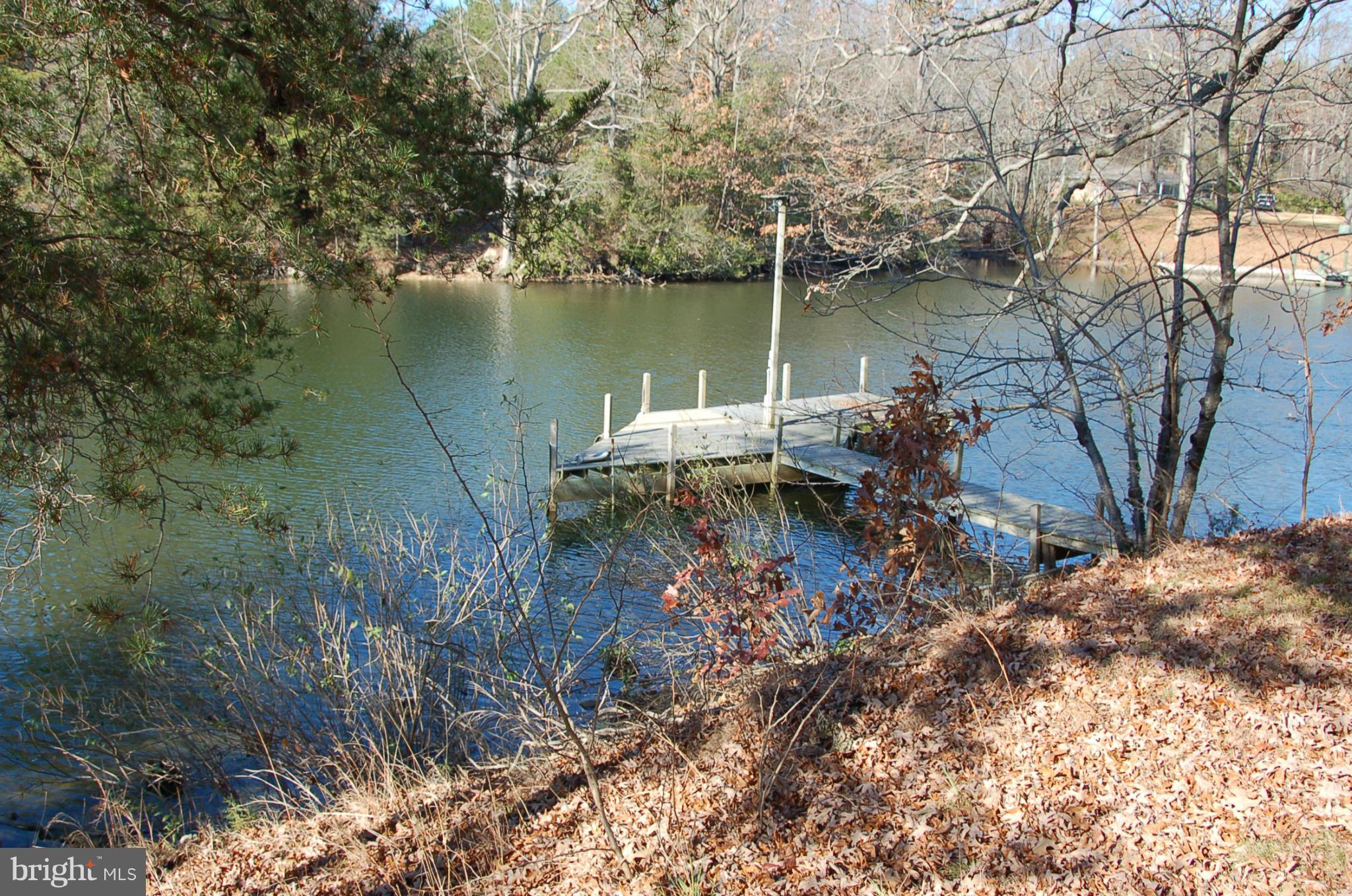 12880 Mccready Road Lusby, MD 20657 - Photo 22 of 30 a backyard of a house with lots of green space