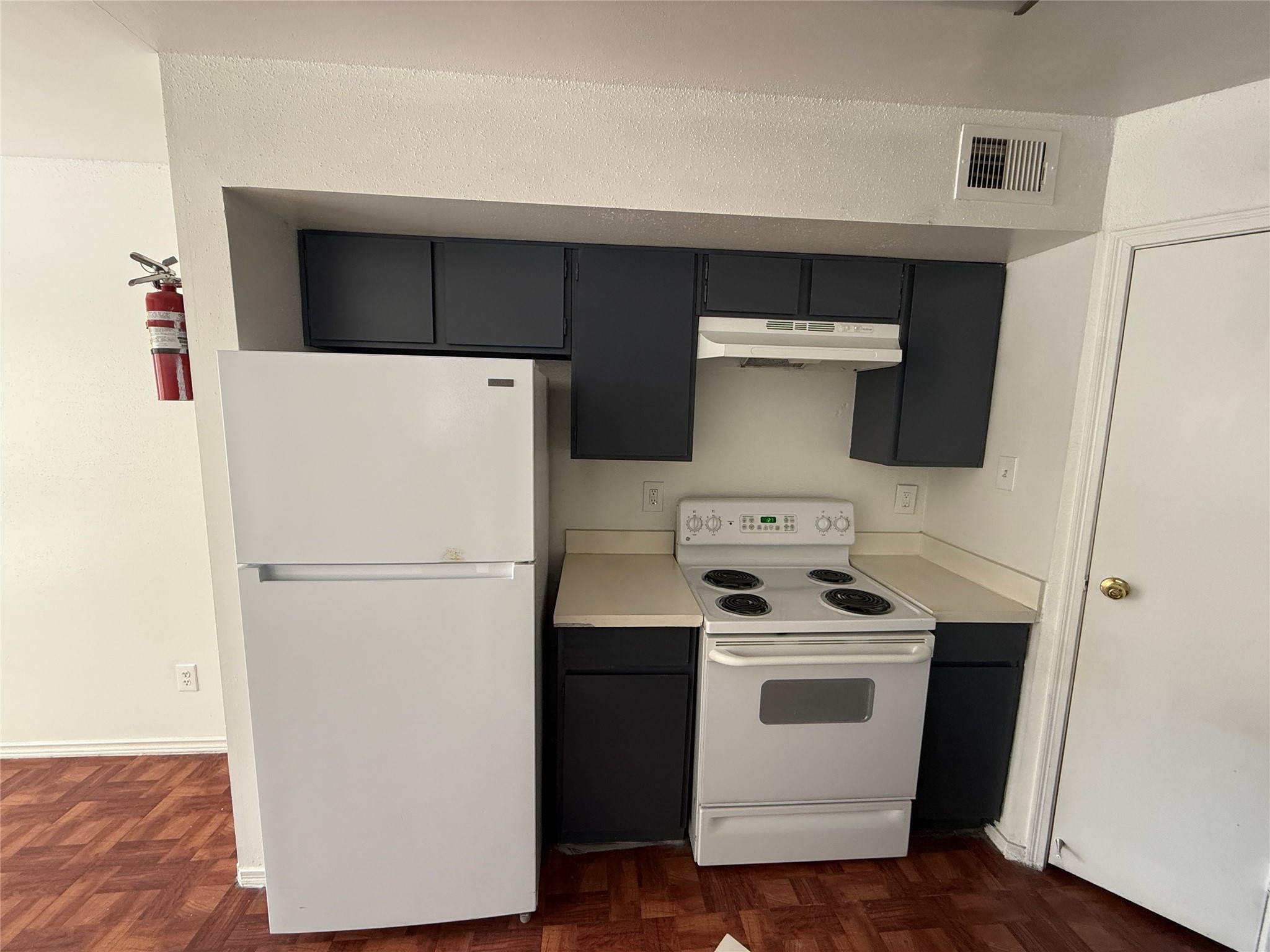7200 West T C Jester Boulevard, Unit 2604 Houston, TX 77088 - Photo 9 of 14 a white stove top oven sitting inside of a white refrigerator