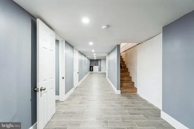 a view of a hallway with stairs