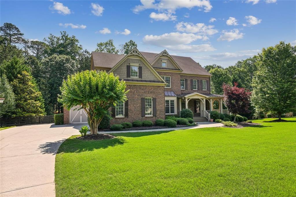 14675 Timber Point Milton, GA 30004 - Photo 1 of 1 a front view of house with yard and green space