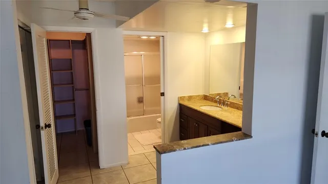 a view of a kitchen from the hallway