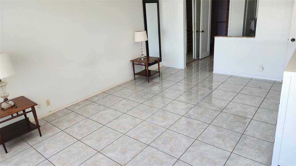 405 North Ocean Boulevard, Unit 1507 Pompano Beach, FL 33062 - Photo 7 of 19 an empty room with windows