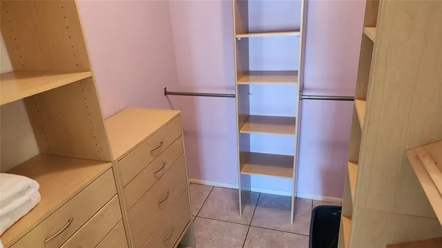 a kitchen with a refrigerator and a stove