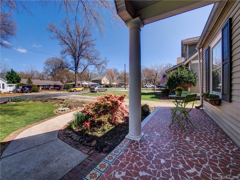 2412 Laburnum Avenue Charlotte, NC 28205 - Photo 2 of 24 a view of a porch with a table and chairs