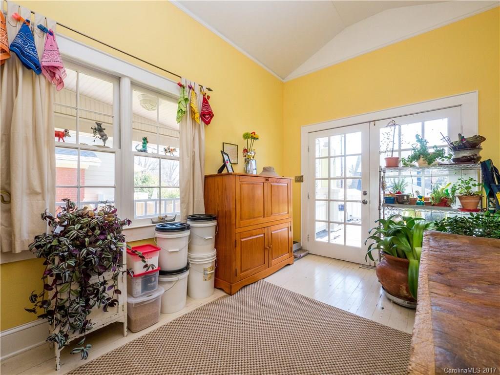 2412 Laburnum Avenue Charlotte, NC 28205 - Photo 13 of 24 a living room with furniture and a large window