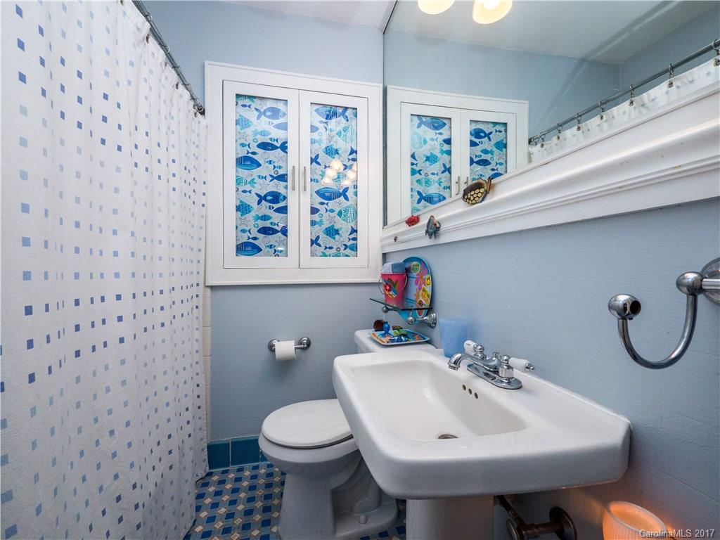 2412 Laburnum Avenue Charlotte, NC 28205 - Photo 14 of 24 a bathroom with a sink toilet and shower