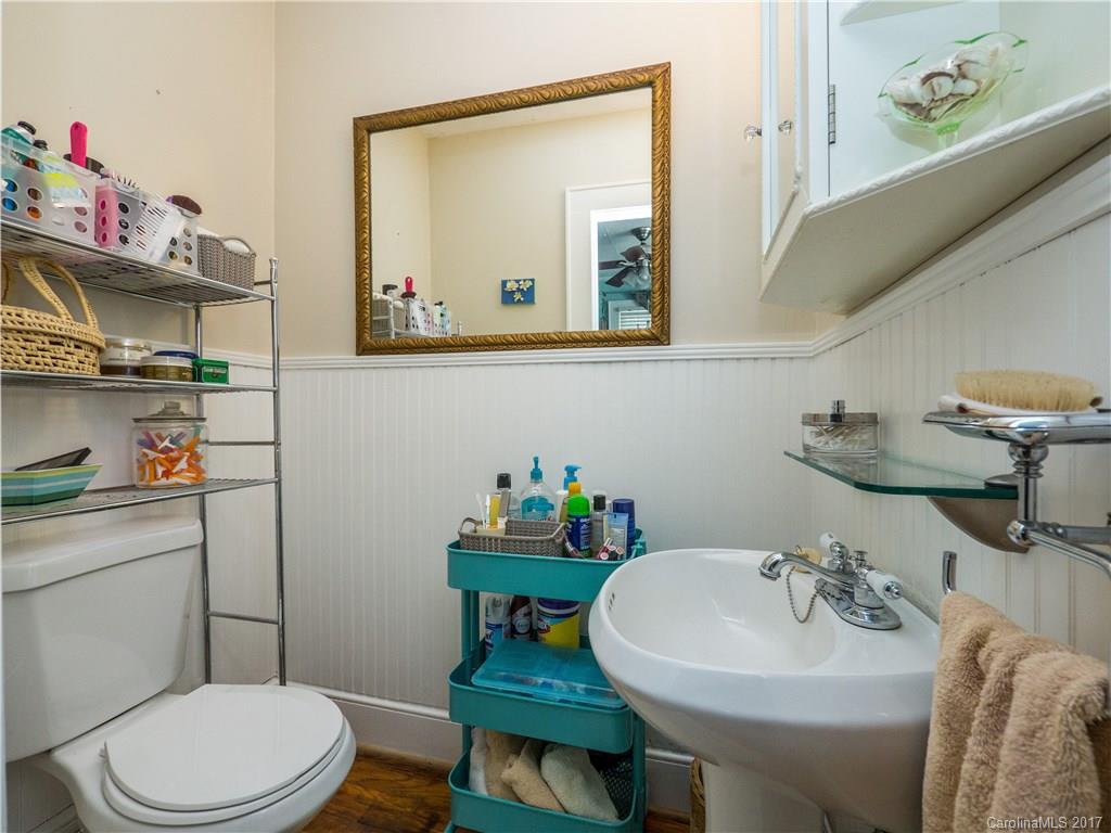 2412 Laburnum Avenue Charlotte, NC 28205 - Photo 17 of 24 a bathroom with a sink mirror and toilet