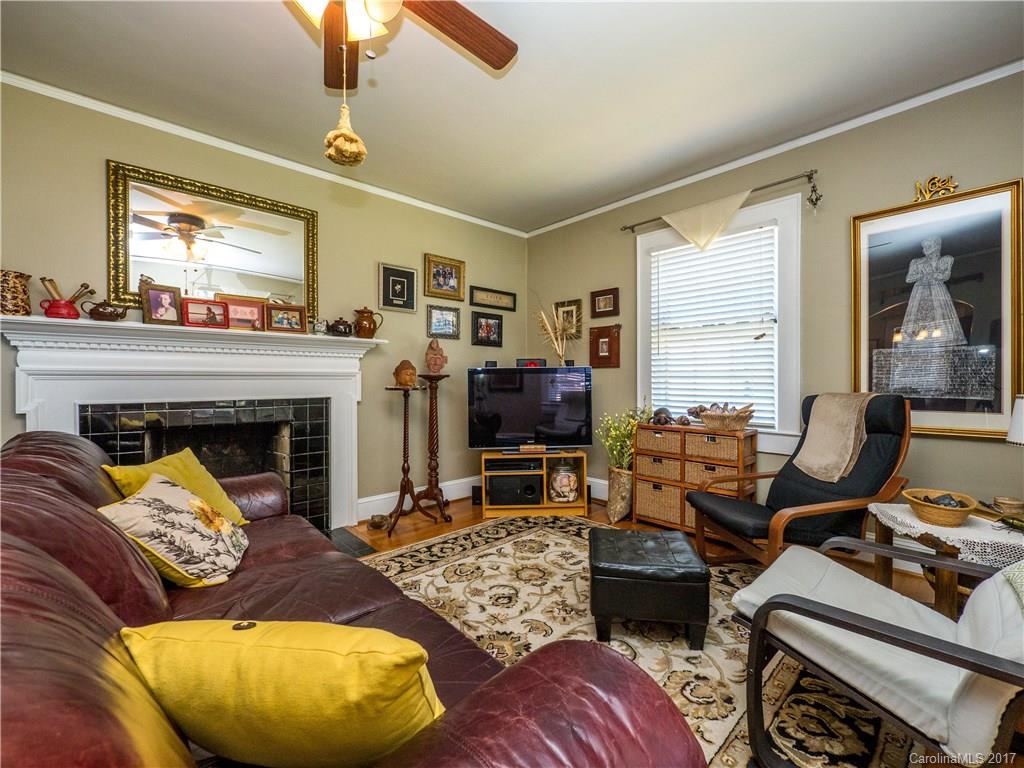 2412 Laburnum Avenue Charlotte, NC 28205 - Photo 4 of 24 a living room with furniture and a fireplace