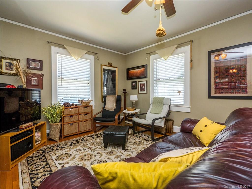 2412 Laburnum Avenue Charlotte, NC 28205 - Photo 5 of 24 a living room with furniture windows and a flat screen tv