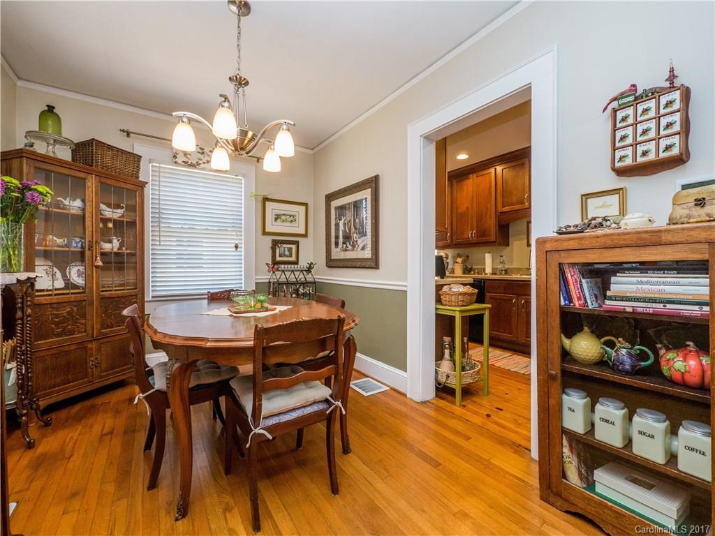 2412 Laburnum Avenue Charlotte, NC 28205 - Photo 7 of 24 a view of a dining room with furniture and wooden floor