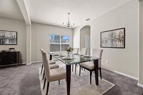 a view of a dining room with furniture