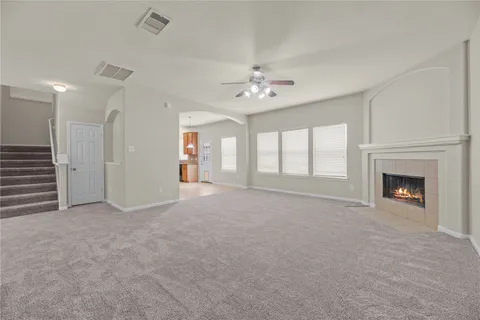 a view of an empty room with a fireplace
