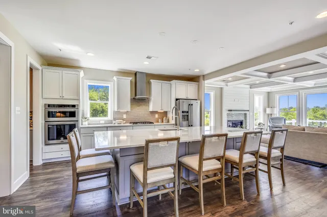 a kitchen with counter top space a sink appliances and cabinets