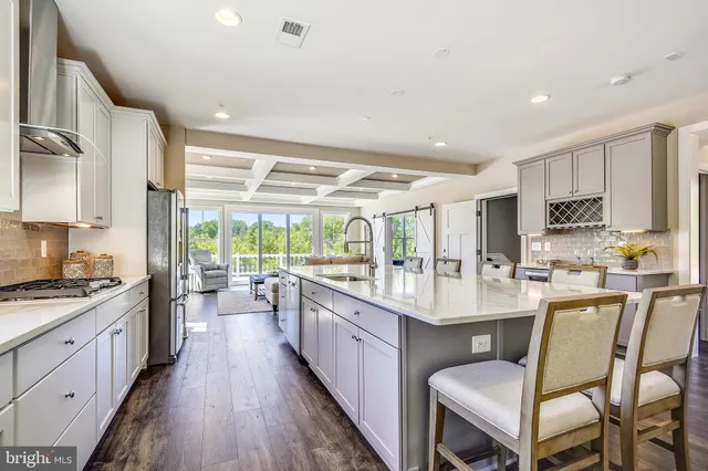 a living room with fireplace furniture and a large window