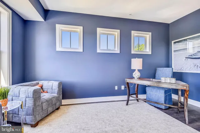 a kitchen with white cabinets and a sink