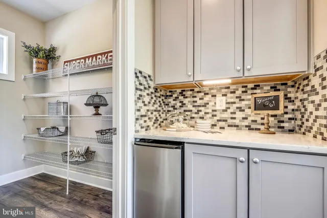 a bathroom with a double vanity sink toilet and shower