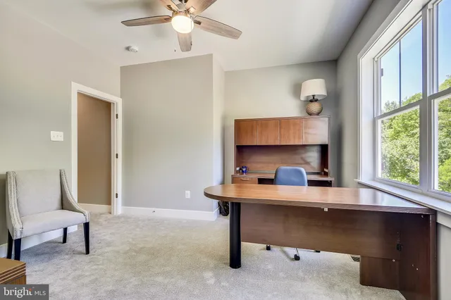 a view of a hallway with staircase