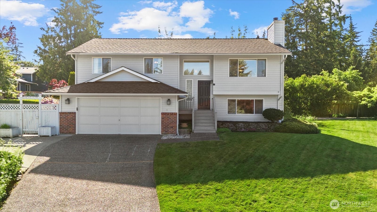 9 199th Place Southeast Bothell, WA 98012 - Photo 1 of 1 a front view of a house with a yard